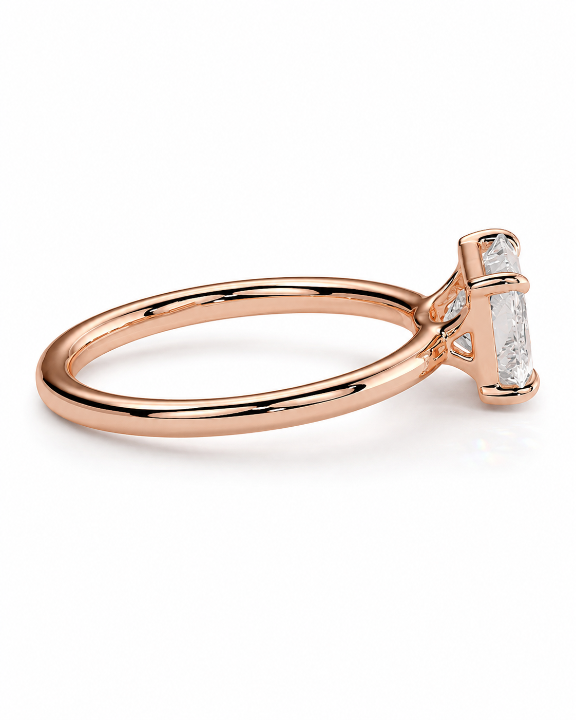color_10K_RG, color_14K_RG &&
A rose gold ring with a single baguette-cut clear gemstone in a prong setting, shown on a clean white background.