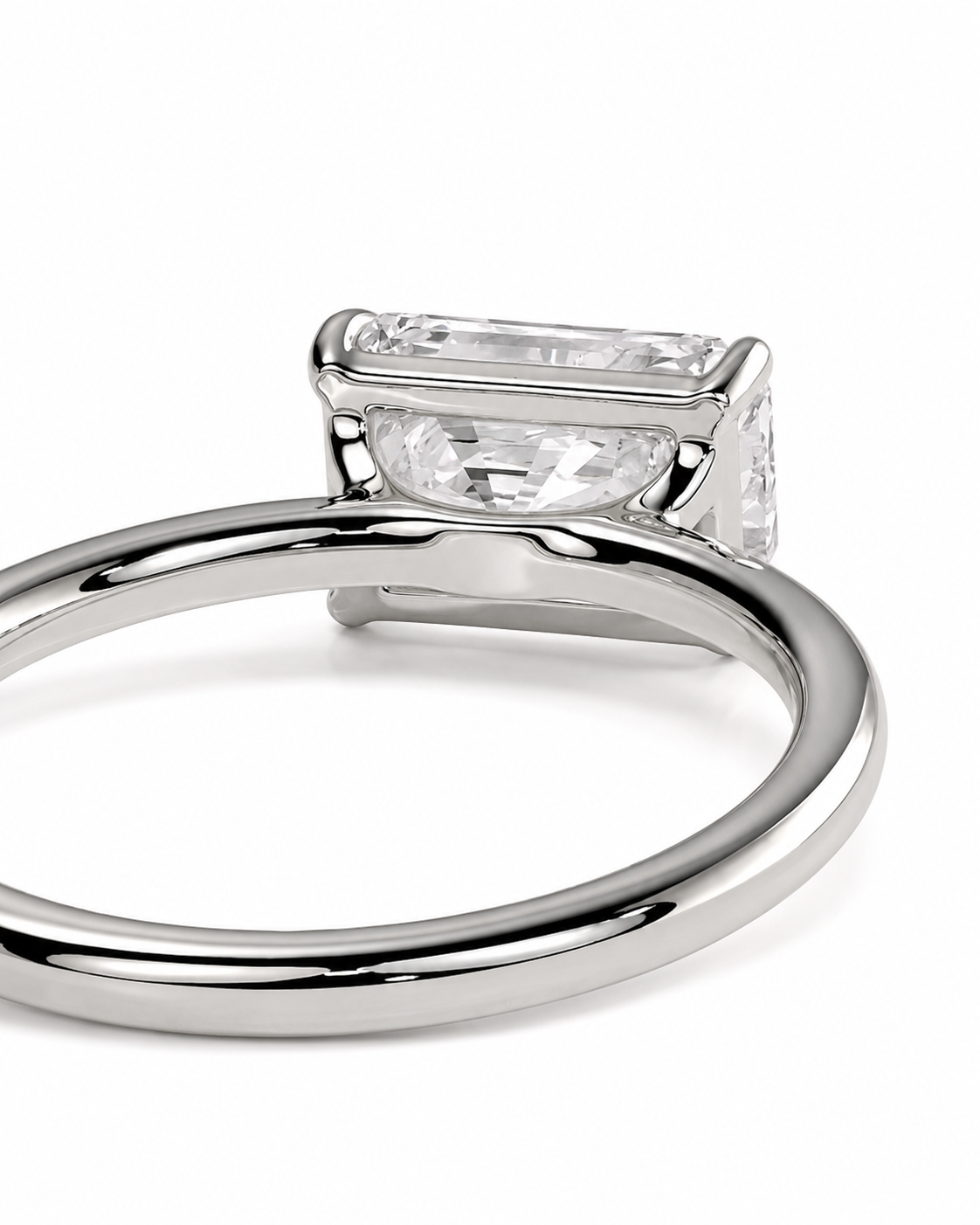 color_925_SIL,color_935_ARG,color_10K_WG, color_14K_WG &&
A close-up shot of a silver-toned ring featuring a rectangular baguette-cut clear gemstone in a prong setting, shown against a plain white background.