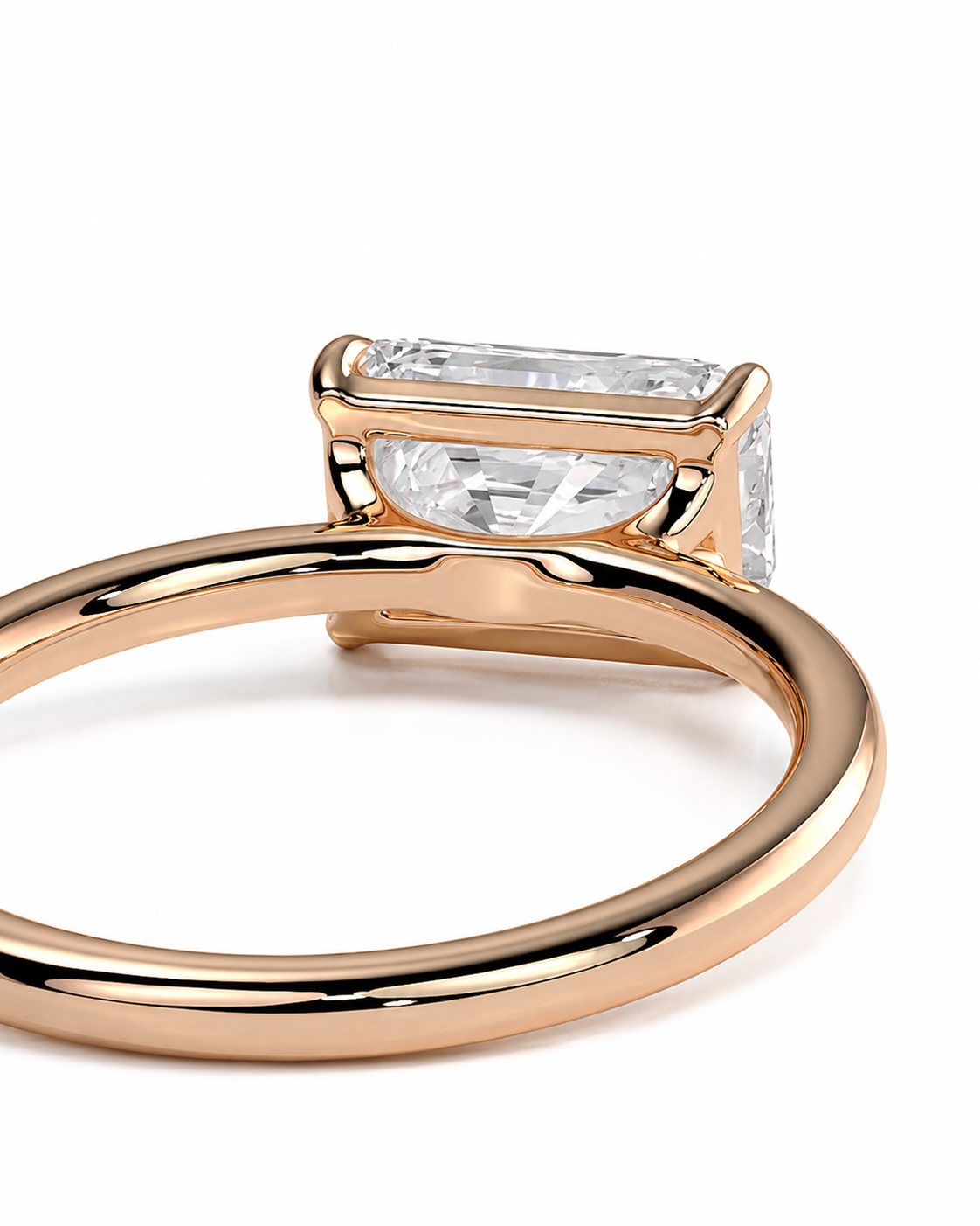 color_10K_RG, color_14K_RG &&
A close-up shot of a rose gold ring with a rectangular clear gemstone, set against a plain white background.