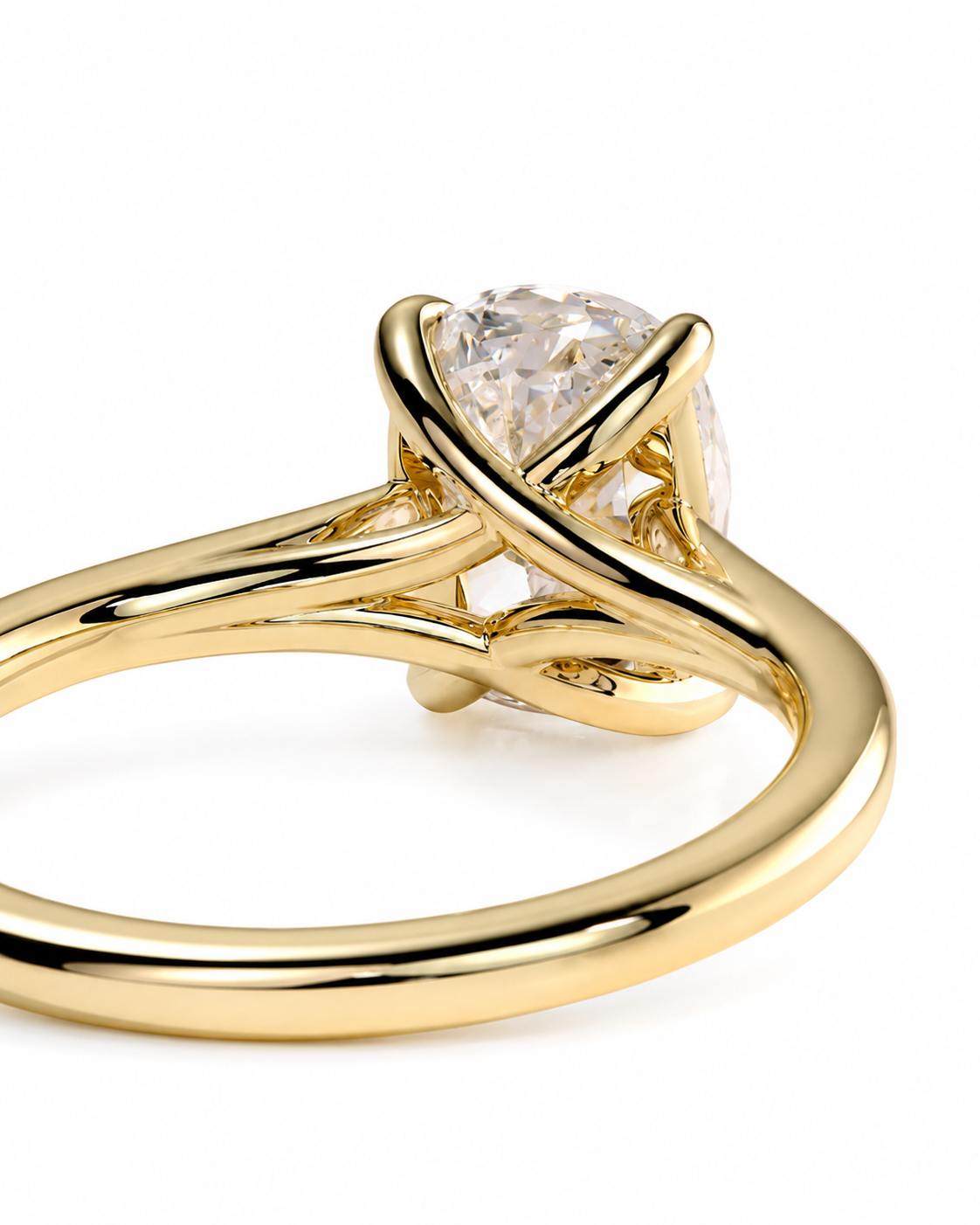 color_10K_YG, color_14K_YG &&A close-up shot of a gold ring featuring a pear-cut clear gemstone in a unique twisted prong setting, shown on a clean white background.