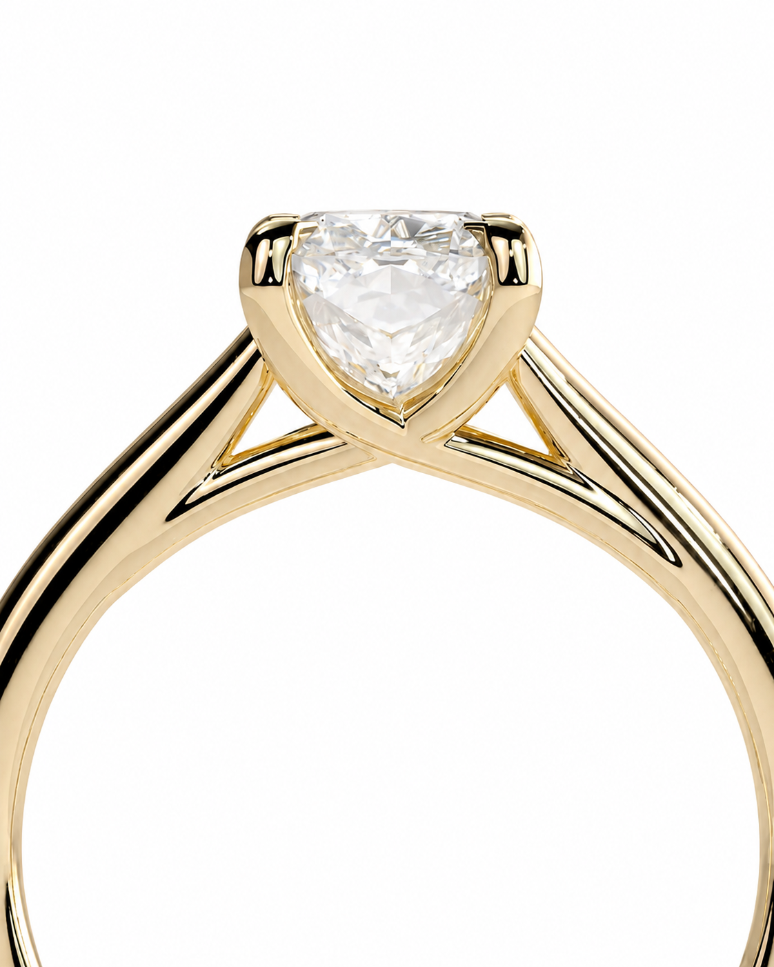 color_10K_YG, color_14K_YG &&A close-up of a yellow gold solitaire engagement ring featuring a heart-shaped clear gemstone in a prong setting, shown against a plain white background.