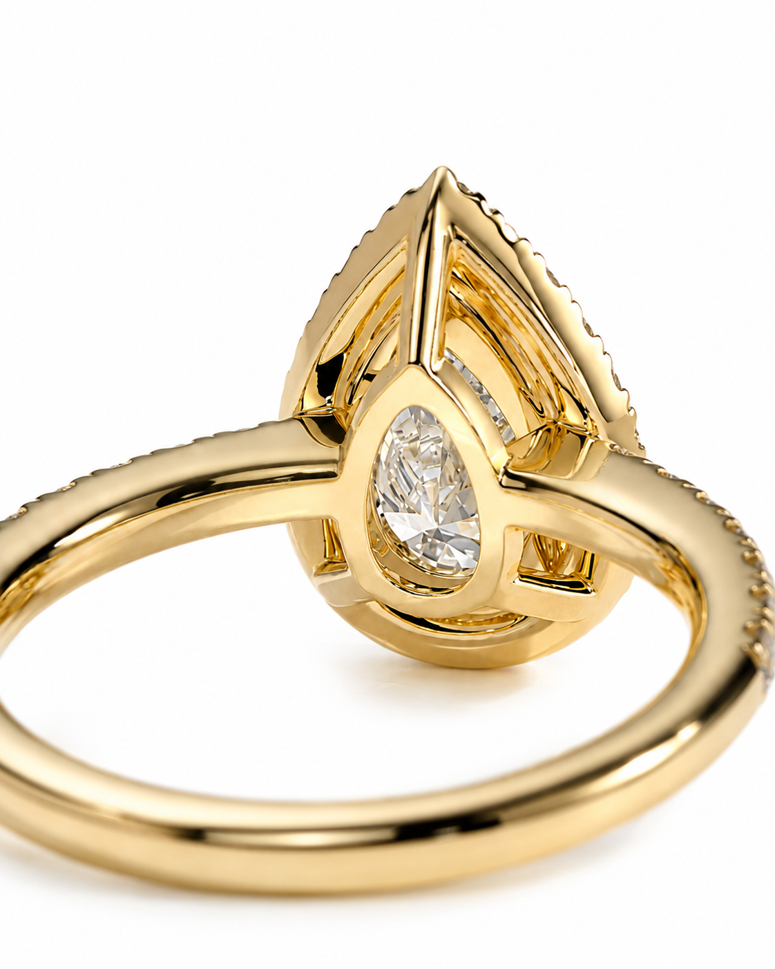 color_10K_YG, color_14K_YG &&A close-up shot of a gold ring featuring a teardrop-shaped diamond cluster with a pear-cut center stone, set against a clean white background.