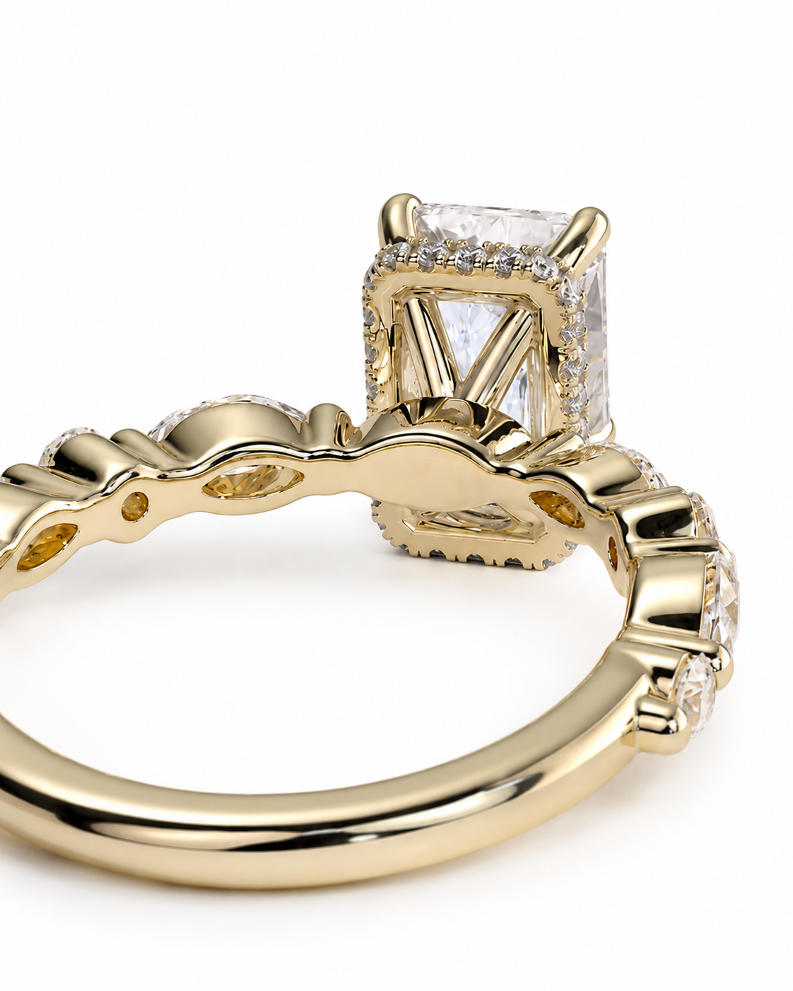 color_10K_YG, color_14K_YG &&A close-up shot of a yellow gold ring featuring a rectangular clear gemstone in a prong setting, accented with small pavé diamonds along the band, on a white background.