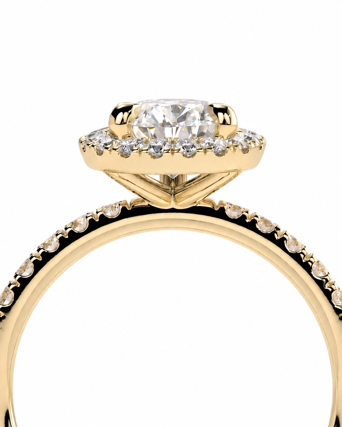 color_10K_YG, color_14K_YG &&A close-up shot of a yellow gold engagement ring featuring a round-cut center diamond surrounded by a halo of small diamonds, with a shank paved with round diamonds, set against a plain white background.