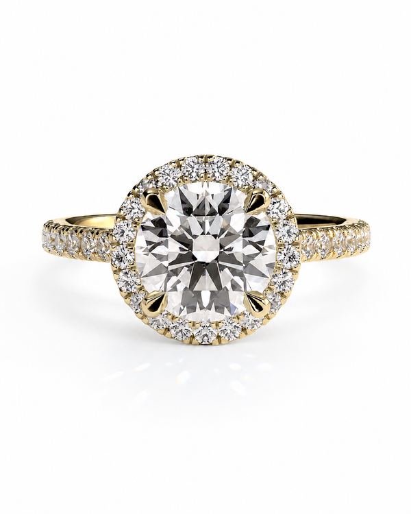 color_10K_YG, color_14K_YG &&A yellow gold halo engagement ring featuring a large round-cut center diamond surrounded by a double halo of smaller diamonds, with the band also paved with diamonds, set against a clean white background.