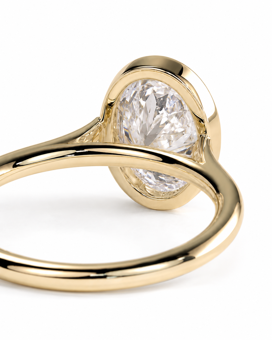 color_10K_YG, color_14K_YG && close-up shot of a gold ring featuring a large, oval-cut clear gemstone in a prong setting, shown against a plain white background.