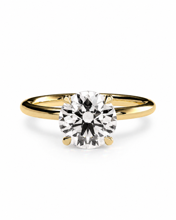 color_10K_YG, color_14K_YG &&A classic solitaire engagement ring featuring a round brilliant-cut diamond set in a yellow gold four-prong band, shown on a clean white background.