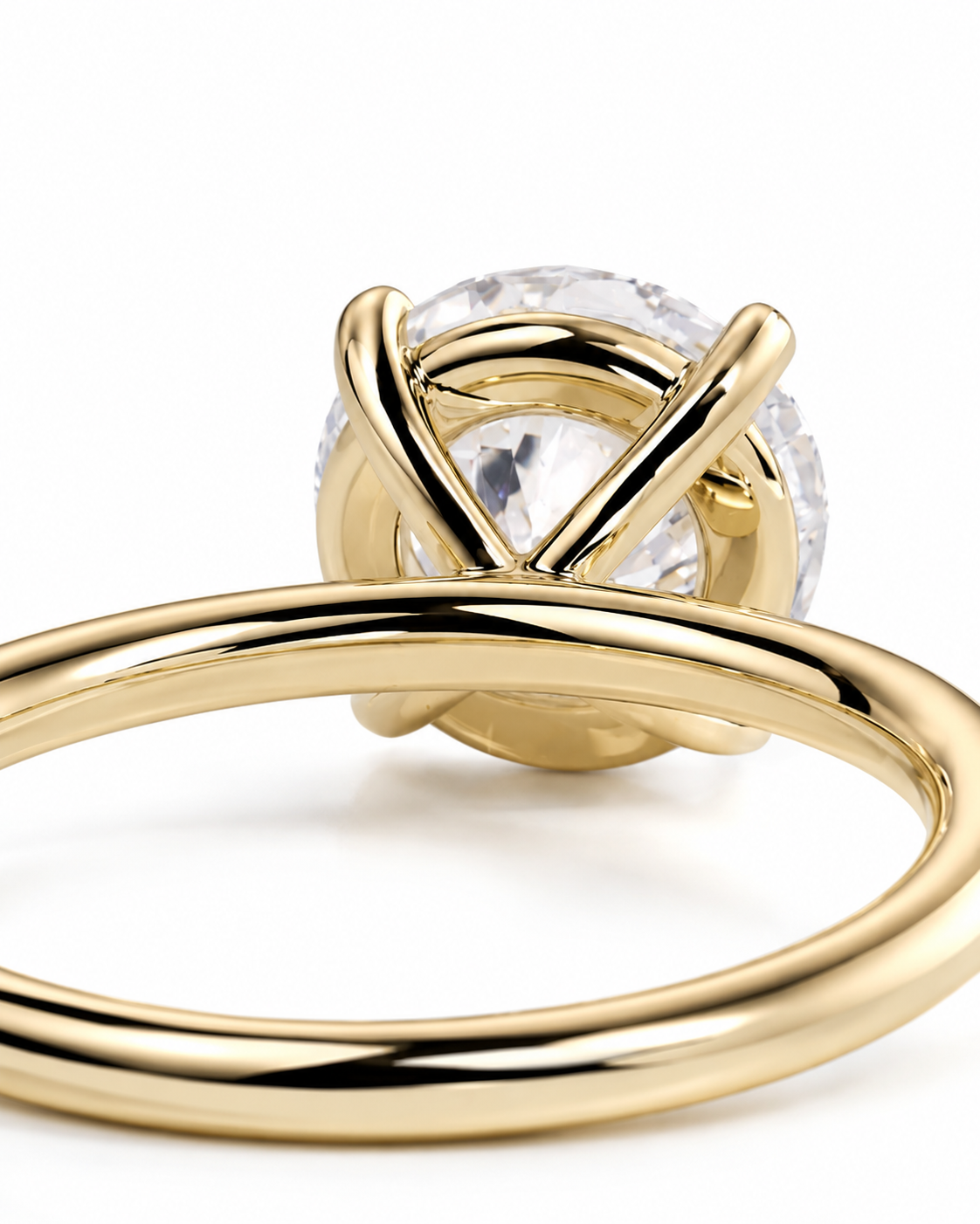 color_10K_YG, color_14K_YG &&A close-up shot of a gold ring with a clear round-cut gemstone in a wrap-style setting, shown on a clean white background.
