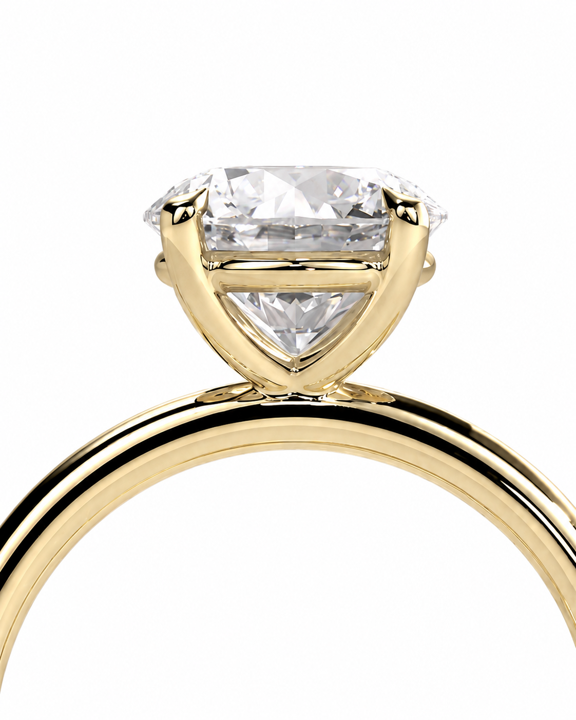 color_10K_YG, color_14K_YG &&A close-up of a yellow gold solitaire engagement ring featuring a large, brilliant-cut clear gemstone in a prong setting, shown against a solid white background.