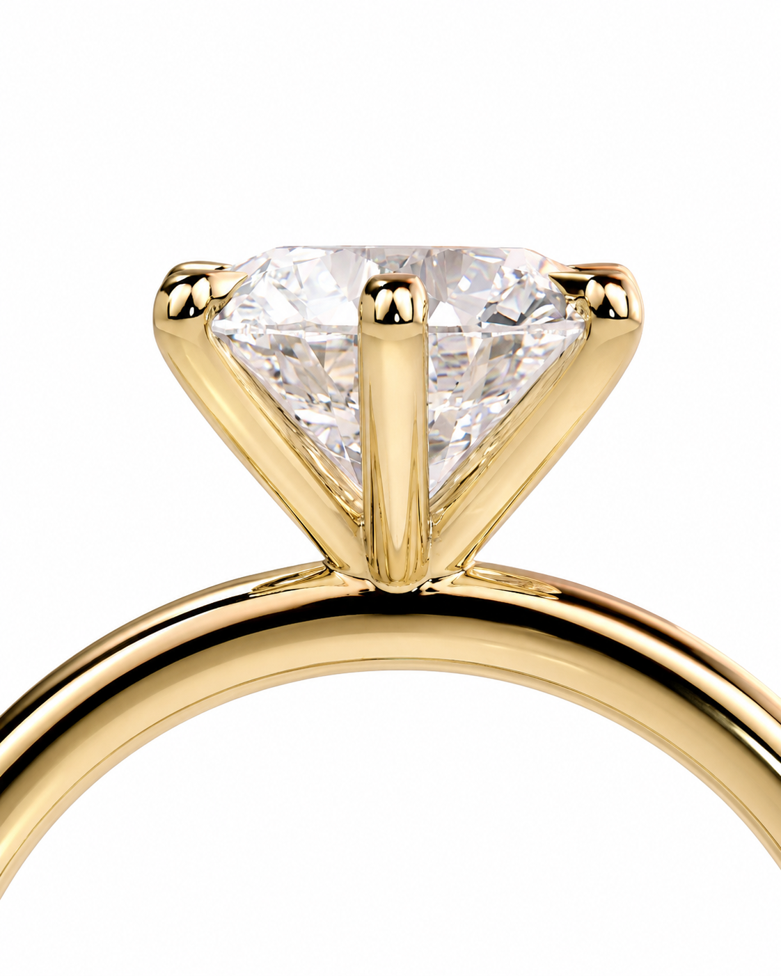 color_10K_YG, color_14K_YG &&Close-up of a yellow gold solitaire ring with a triangular clear gemstone in a four-prong setting, shown against a plain white background.