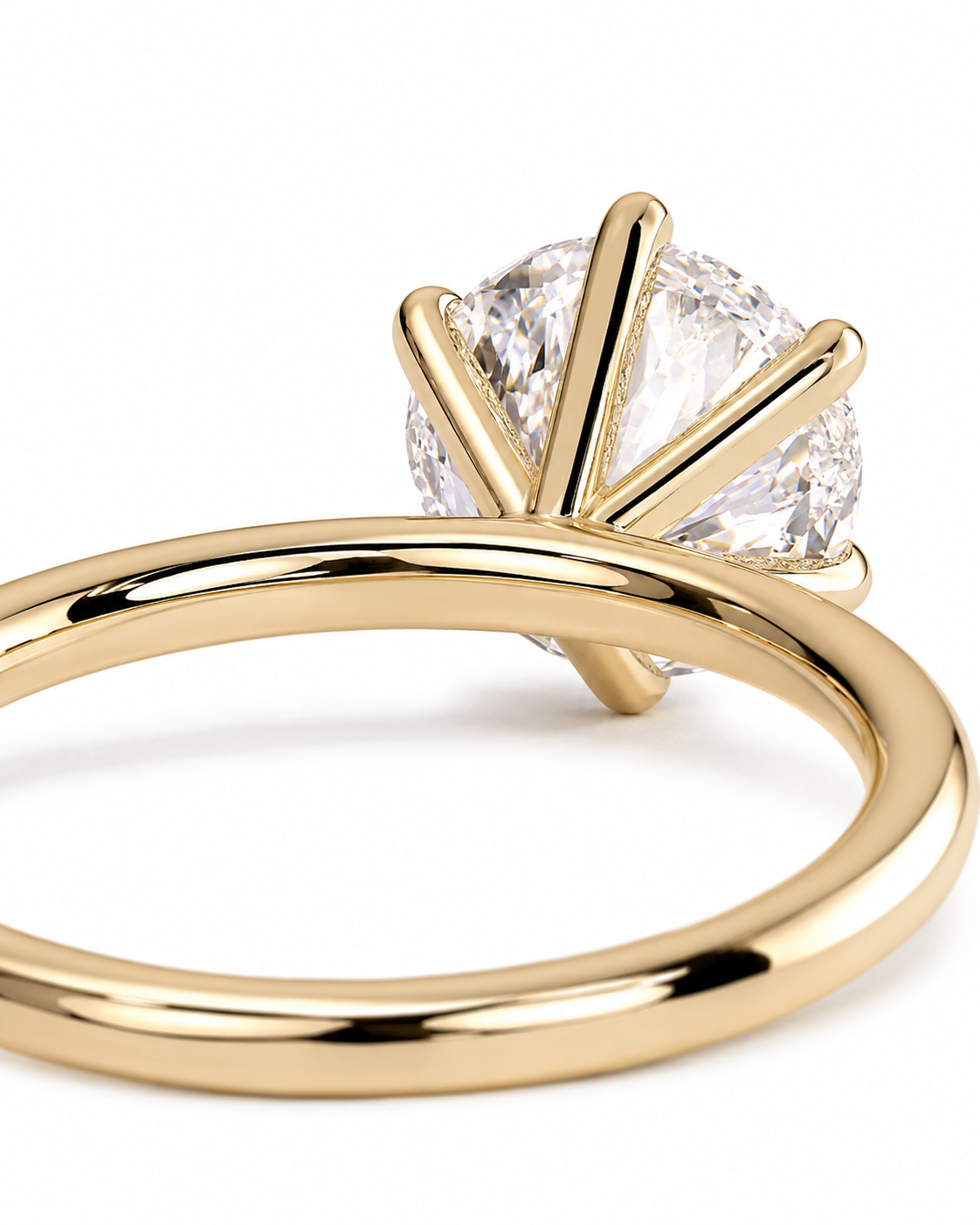 color_10K_YG, color_14K_YG &&A close-up shot of a yellow gold solitaire engagement ring with a round brilliant-cut diamond, set against a clean white background.