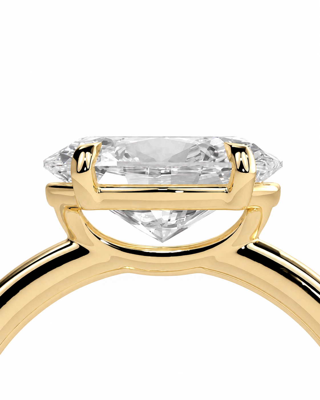 color_10K_YG, color_14K_YG &&A close-up of a yellow gold ring setting with a clear marquise-cut diamond, shown against a plain white background.
