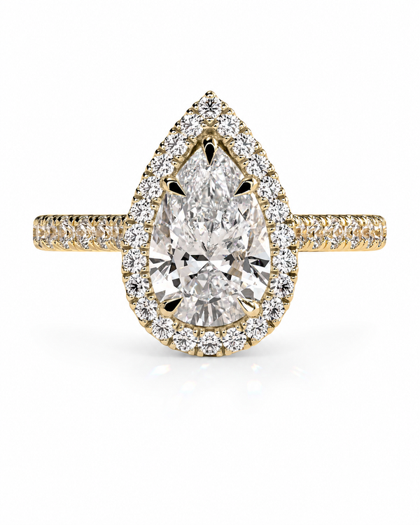 color_10K_YG, color_14K_YG &&A pear-shaped halo ring featuring a large central round-cut diamond surrounded by a double halo of smaller diamonds, set in yellow gold with a diamond-paved band, shown on a white background.