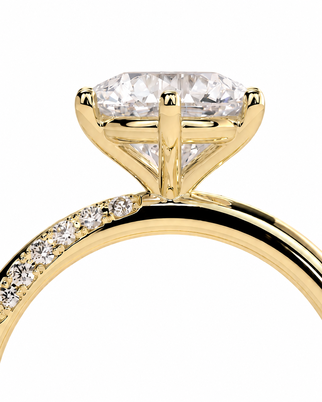 color_10K_YG, color_14K_YG &&A close-up of a yellow gold ring featuring a marquise-cut diamond center stone and a pavé diamond band, set against a plain white background.