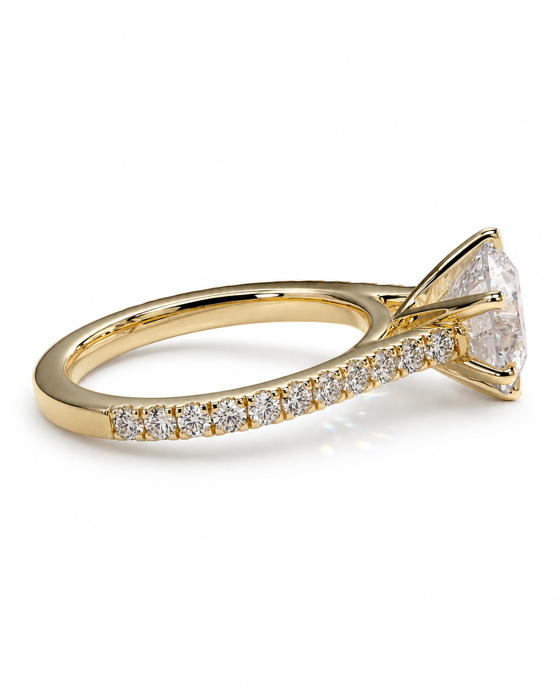 color_10K_YG, color_14K_YG &&A yellow gold diamond ring with a large round-cut center stone and a pavé band set with small diamonds, shown on a clean white background.