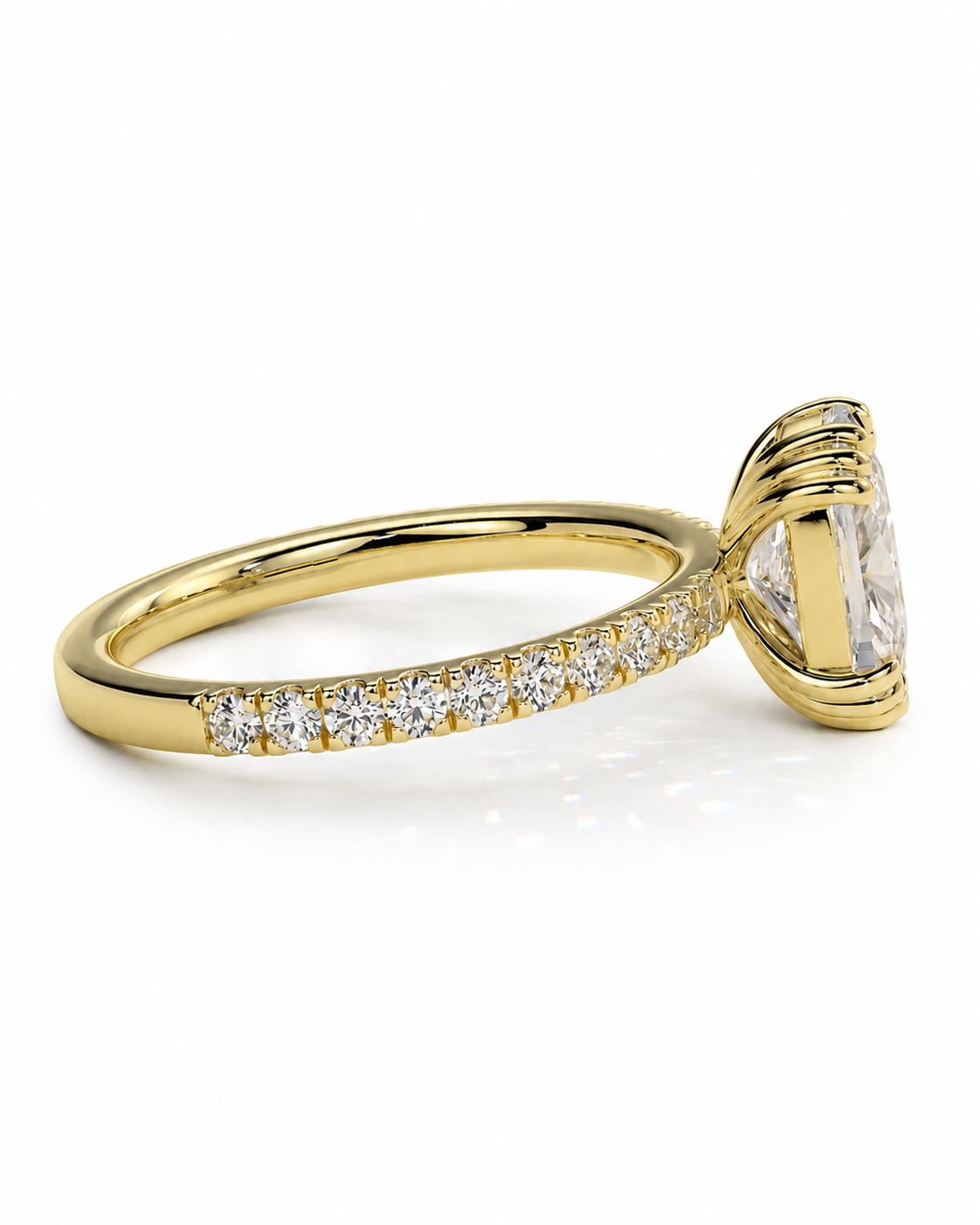 color_10K_YG, color_14K_YG &&A yellow gold ring featuring a large marquise-cut clear gemstone in a prong setting, with a pavé band adorned with small round diamonds, shown on a white background.