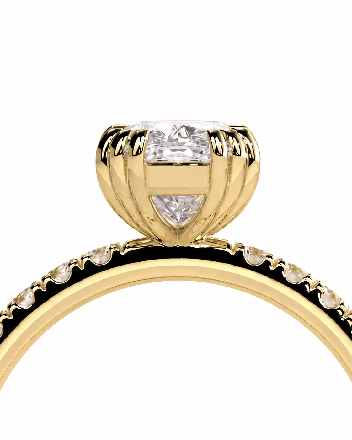 color_10K_YG, color_14K_YG &&A close-up of a yellow gold ring featuring a large round-cut center stone and smaller stones along the band, set against a plain white background.