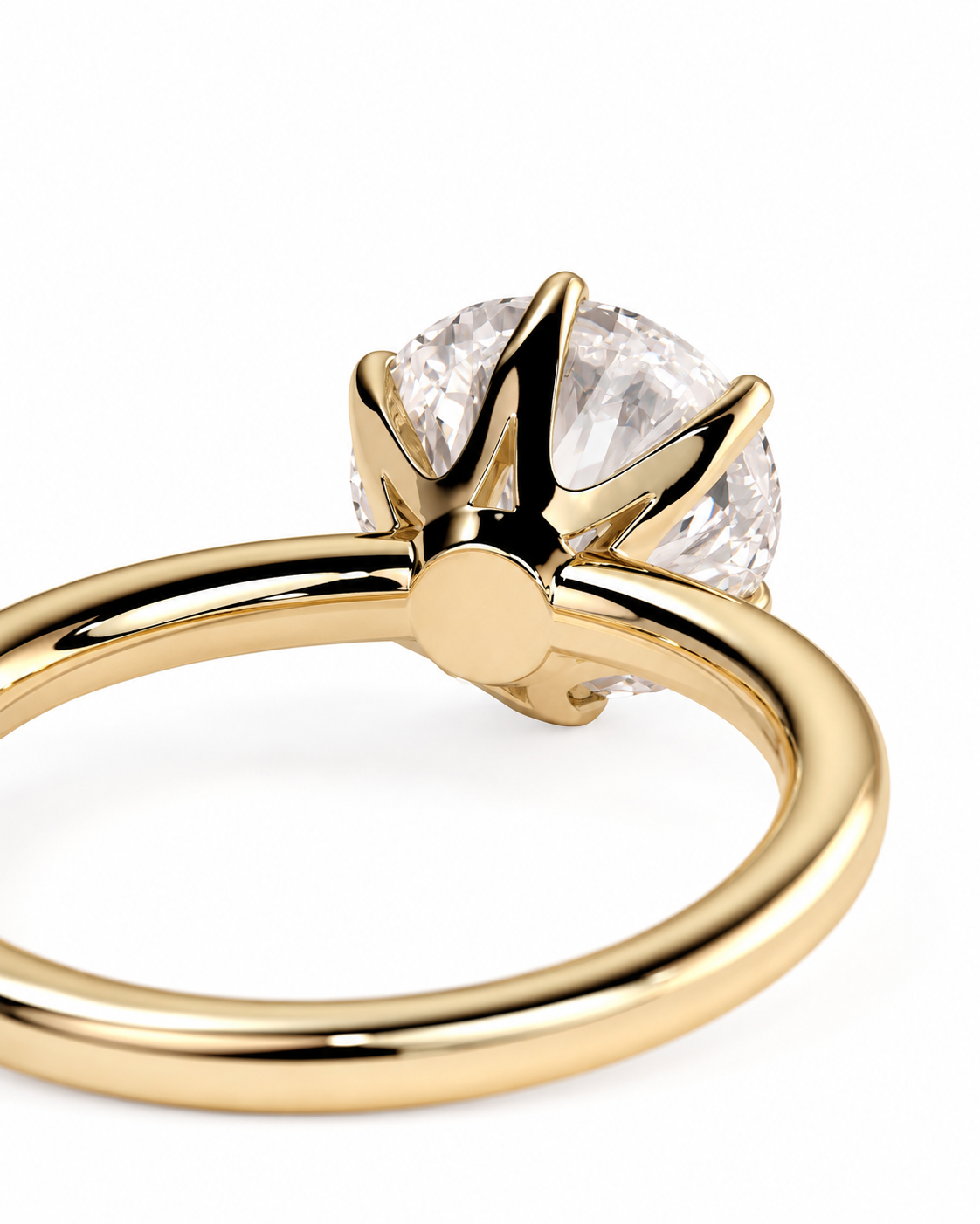 color_10K_YG, color_14K_YG &&A close-up shot of a yellow gold solitaire ring with a round brilliant-cut clear gemstone in a prong setting, on a clean white background.