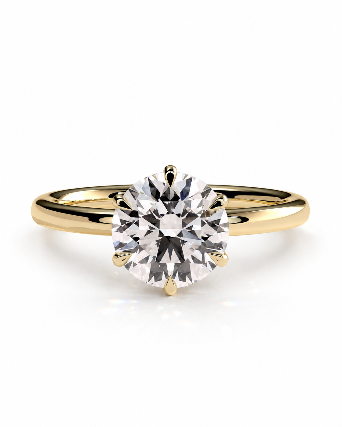 color_10K_YG, color_14K_YG &&A classic solitaire engagement ring featuring a round brilliant-cut diamond set in a yellow gold four-prong setting on a polished gold band, shown against a clean white background.