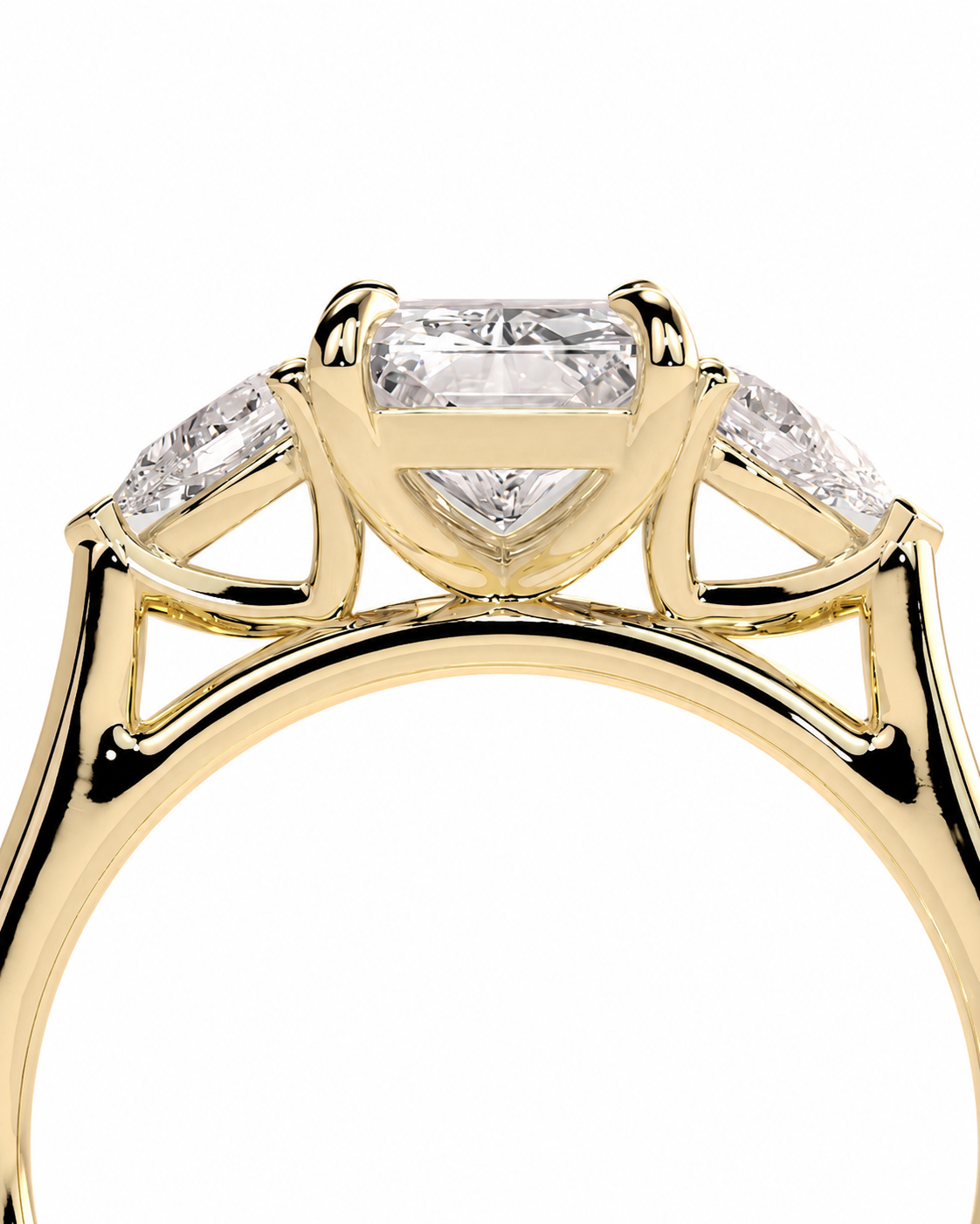 color_10K_YG, color_14K_YG &&
A close-up shot of a yellow gold ring featuring a central rectangular baguette diamond flanked by two smaller round diamonds on the shoulders, set against a plain white background.