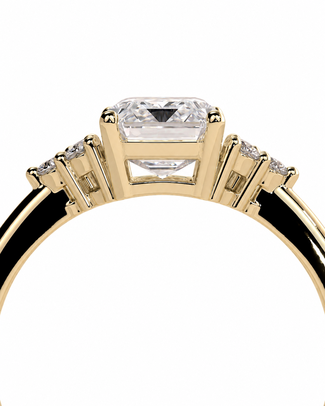 color_10K_YG, color_14K_YG &&A close-up of a yellow gold ring featuring a large rectangular clear gemstone in a prong setting, with smaller accent stones on either side of the band, shown against a plain white background.