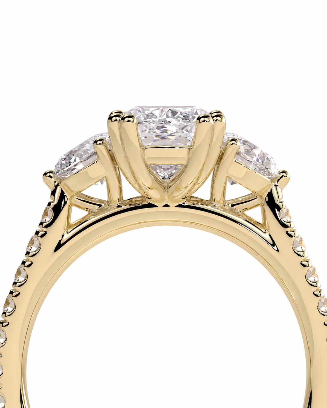 color_10K_YG, color_14K_YG &&A close-up of a yellow gold ring featuring a three-stone diamond engagement setting with a large center diamond and smaller side diamonds, shown against a plain white background.
