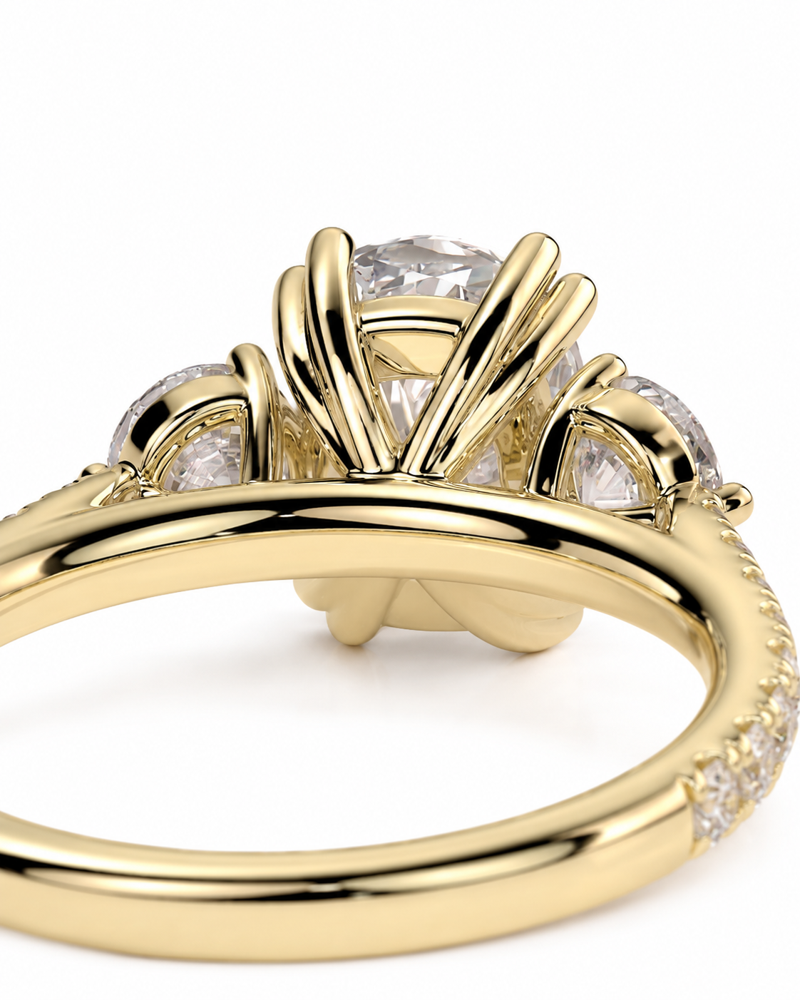 color_10K_YG, color_14K_YG &&A close-up of a yellow gold ring featuring a large round clear center stone and smaller clear stones along the shoulders and band, set against a plain white background.
