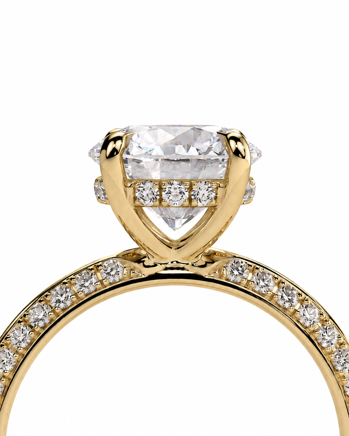 color_10K_YG, color_14K_YG &&A close-up of a yellow gold ring featuring a large cushion-cut diamond center stone, accent diamonds on the shoulders, and a pavé-set diamond band, shown against a plain white background.