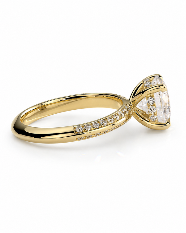 color_10K_YG, color_14K_YG &&A yellow gold diamond ring with a marquise-cut center stone and pavé-set diamonds along the shank, shown on a clean white background.