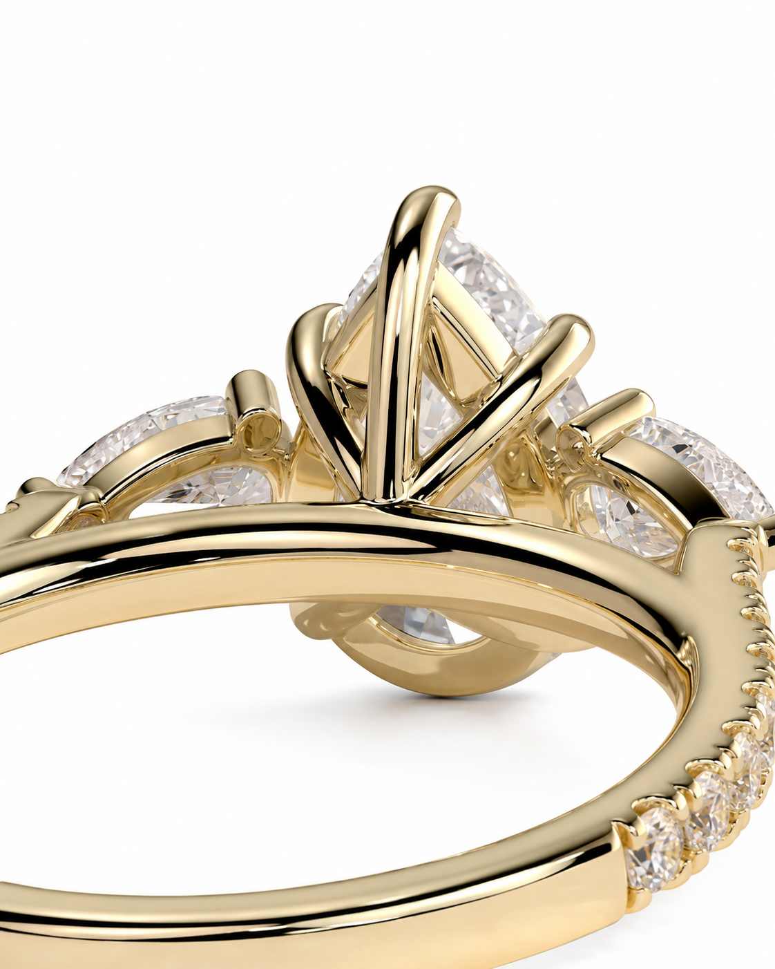 color_10K_YG, color_14K_YG &&A close-up of a yellow gold ring featuring a large triangular center stone and smaller stones along the shoulders, set against a plain white background.
