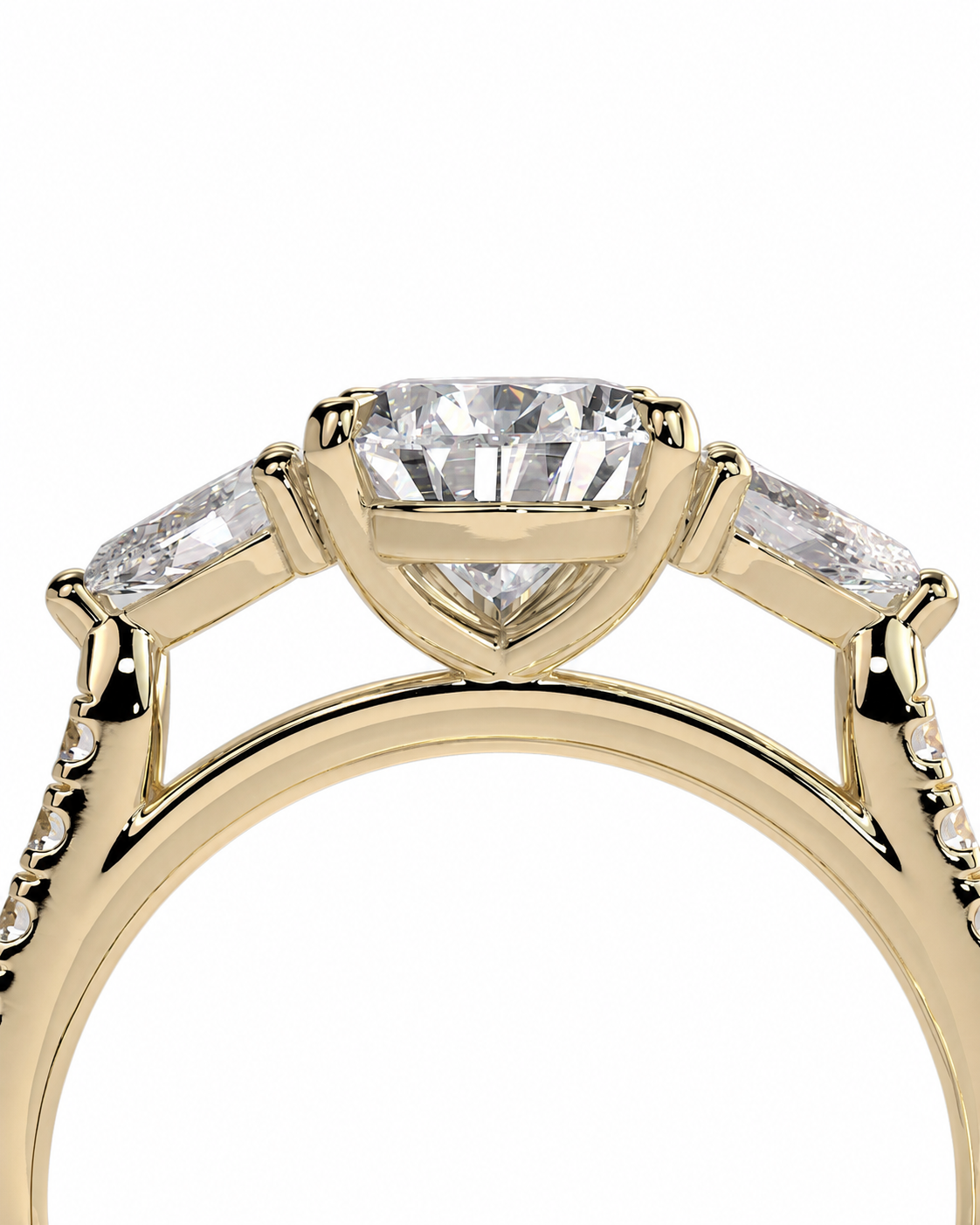 color_10K_YG, color_14K_YG &&A close-up of a yellow gold three-stone ring featuring a marquise-cut center stone and baguette side stones, set against a plain white background.