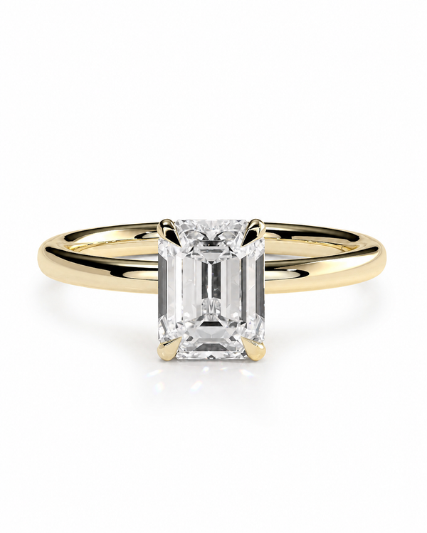 color_10K_YG, color_14K_YG &&A yellow gold solitaire engagement ring featuring a rectangular emerald-cut diamond center stone, set against a clean white background.