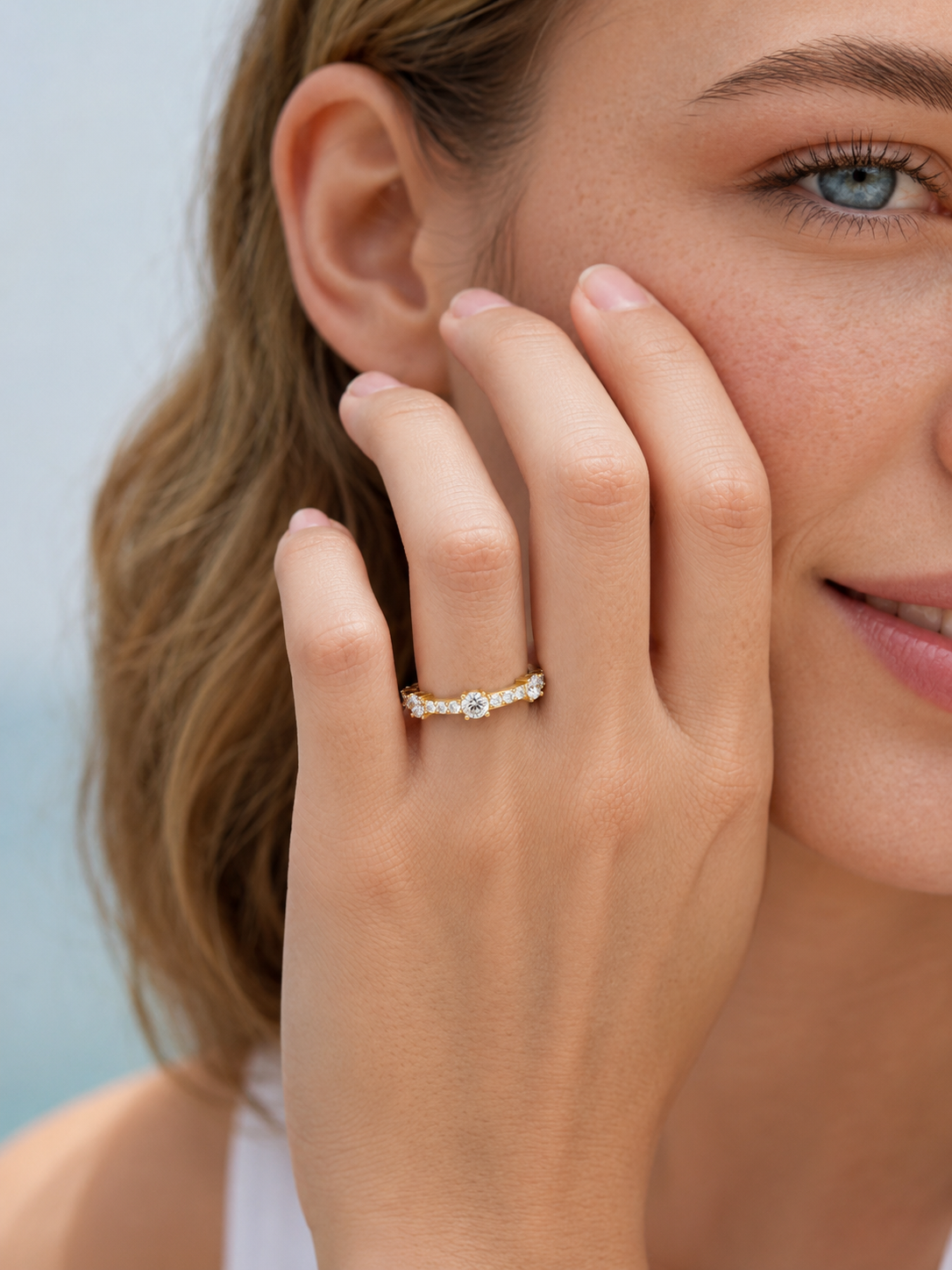 color_10K_YG, color_14K_YG &&Modern moissanite wedding ring with alternating round stones viewed from the side
