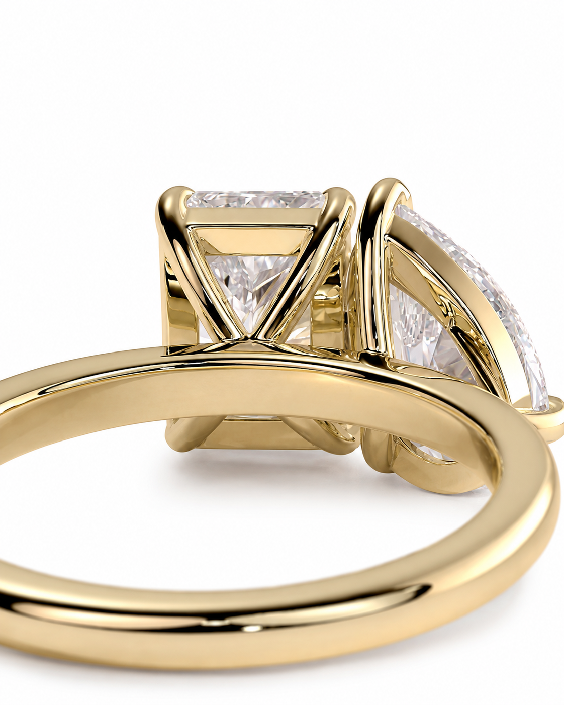 color_10K_YG, color_14K_YG &&A close-up of a yellow gold ring featuring a large rectangular diamond and smaller marquise-cut diamonds set in a split-prong design, shown on a clean white background.