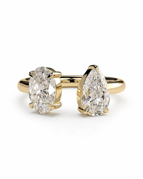 color_10K_YG, color_14K_YG &&A pair of gold rings featuring pear-cut diamonds, set against a clean white background.