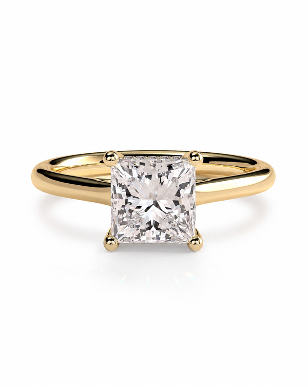 color_10K_YG, color_14K_YG &&A classic yellow gold solitaire engagement ring featuring a large, brilliant-cut princess diamond in a four-prong setting, shown on a clean white background.