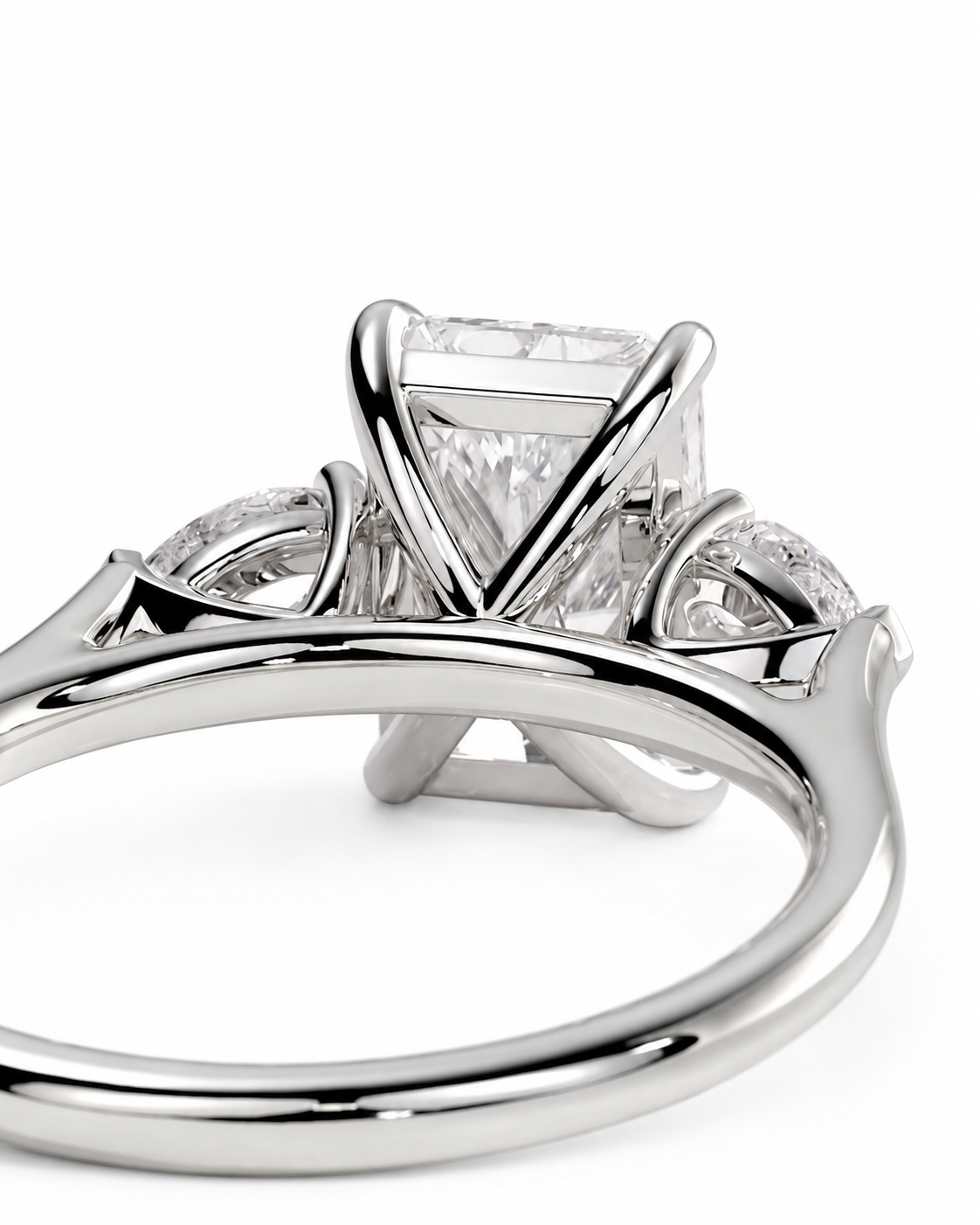 color_925_SIL,color_935_ARG,color_10K_WG, color_14K_WG &&
A close-up studio shot of a silver-toned ring with a large rectangular clear gemstone and smaller side stones, shown on a plain white background.