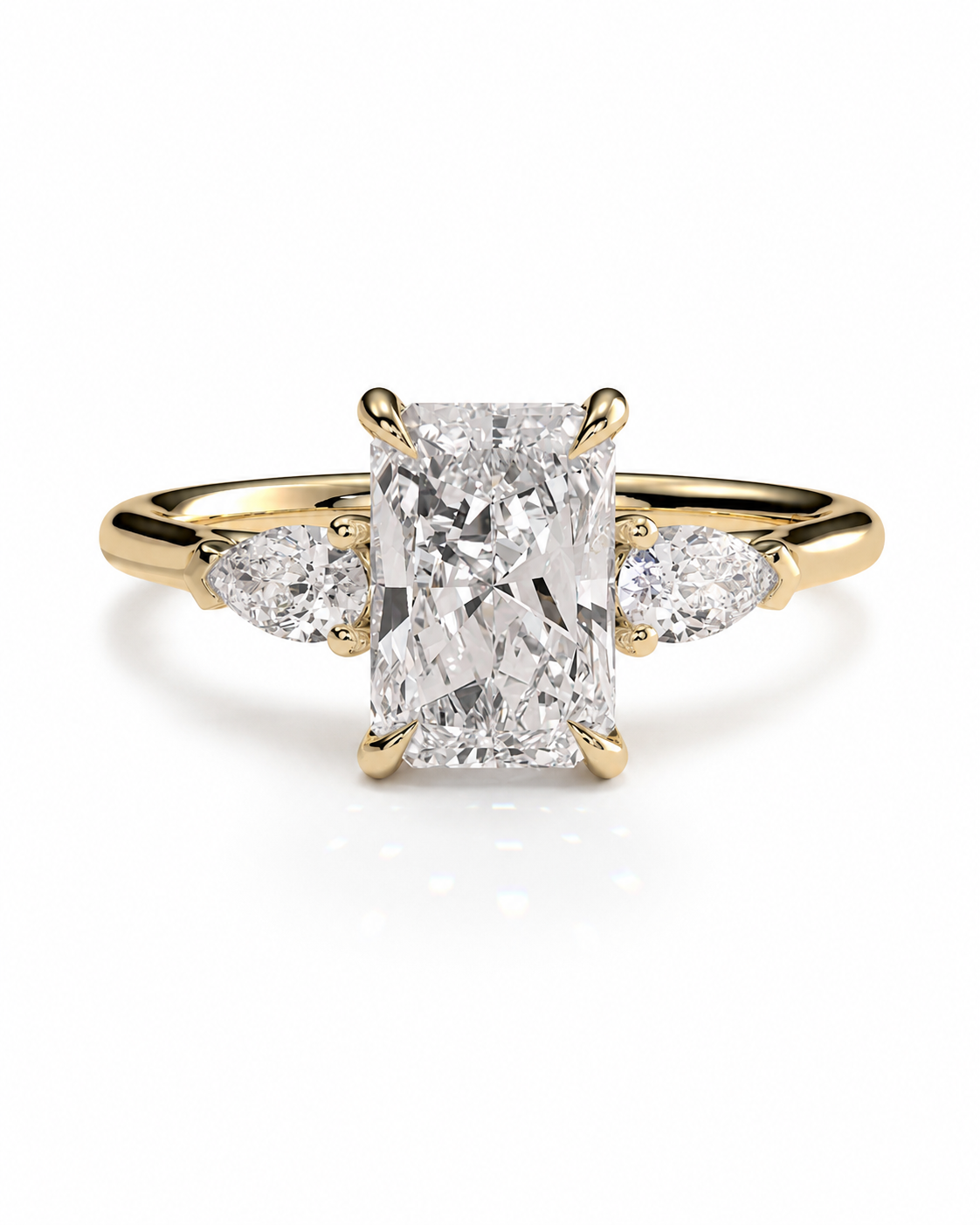 color_10K_YG, color_14K_YG &&A yellow gold ring featuring a large rectangular radiant-cut diamond center stone with two smaller marquise-cut diamonds on either side, set against a clean white background.