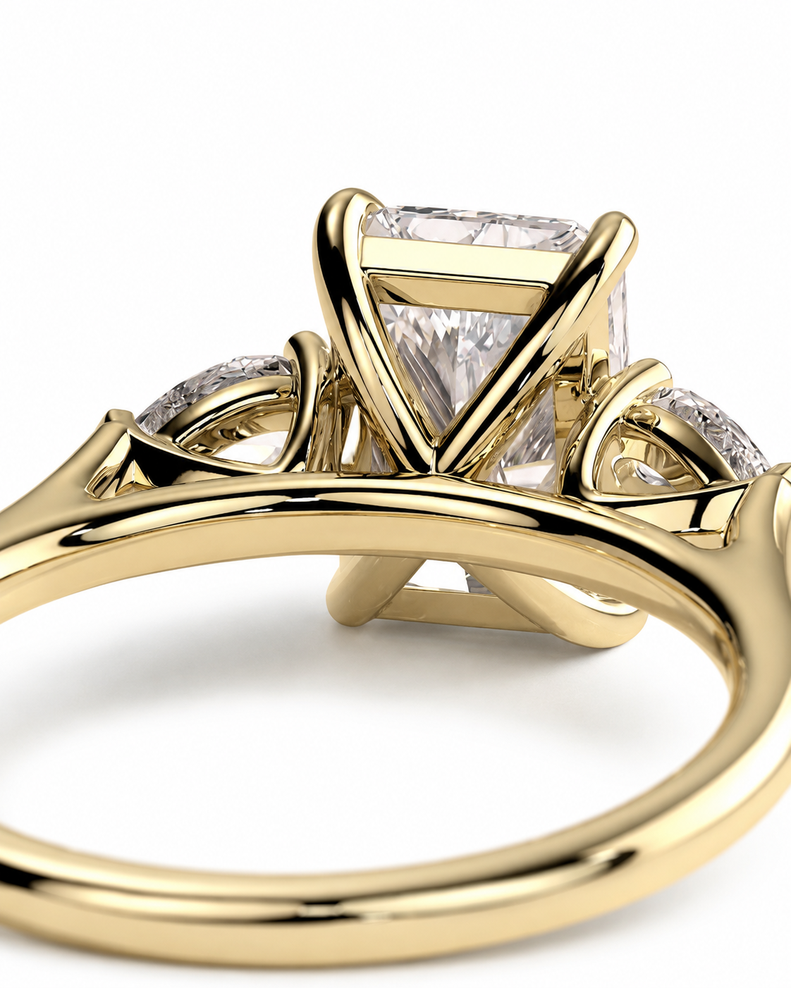 color_10K_YG, color_14K_YG &&
A close-up of a yellow gold ring featuring a rectangular clear center stone and smaller stones along the shoulders, shown on a clean white background.