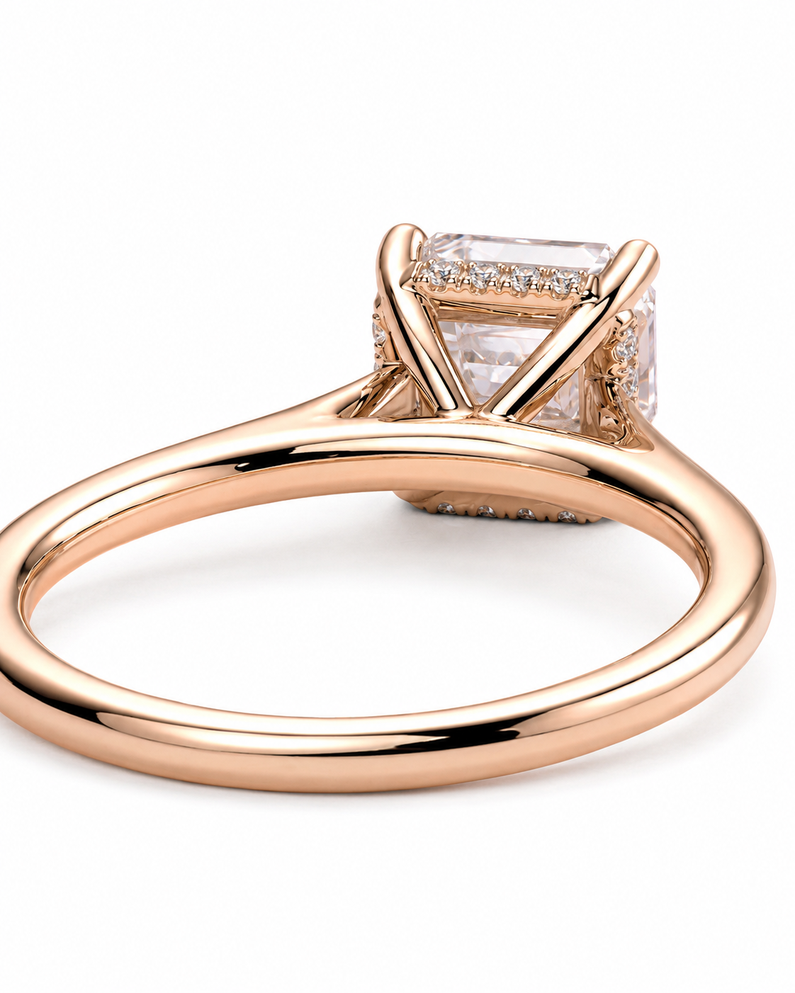 color_10K_RG, color_14K_RG &&	Rose gold ring with a large rectangular clear gemstone in a four-prong setting, accented by small pave diamonds along the top and shoulders, shown on a white background.