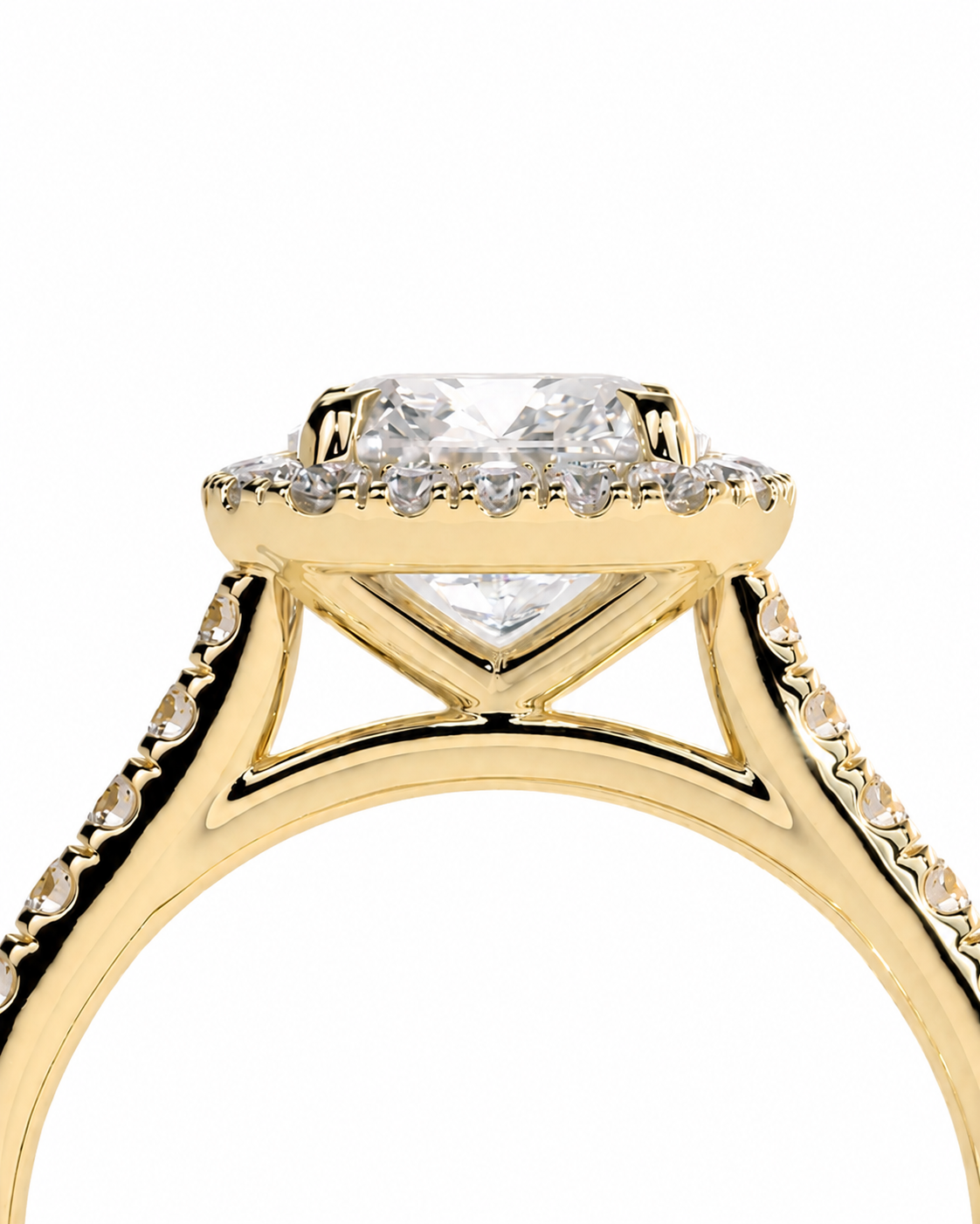 color_10K_YG, color_14K_YG &&	
A close-up of a yellow gold ring with a large clear center stone and a halo of smaller diamonds, set against a plain white background.