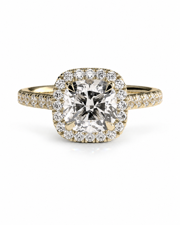 color_10K_YG, color_14K_YG &&	
A yellow gold halo ring featuring a large cushion-cut diamond center stone surrounded by a double halo of smaller round diamonds, with the band adorned with pave diamonds, set against a clean white background.