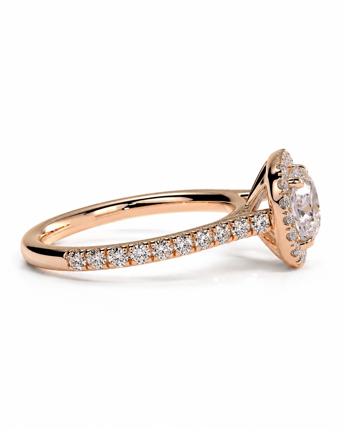 color_10K_RG, color_14K_RG &&	A rose gold engagement ring featuring a round-cut center stone surrounded by a halo, with a pave band set with small round stones, shown on a white background.