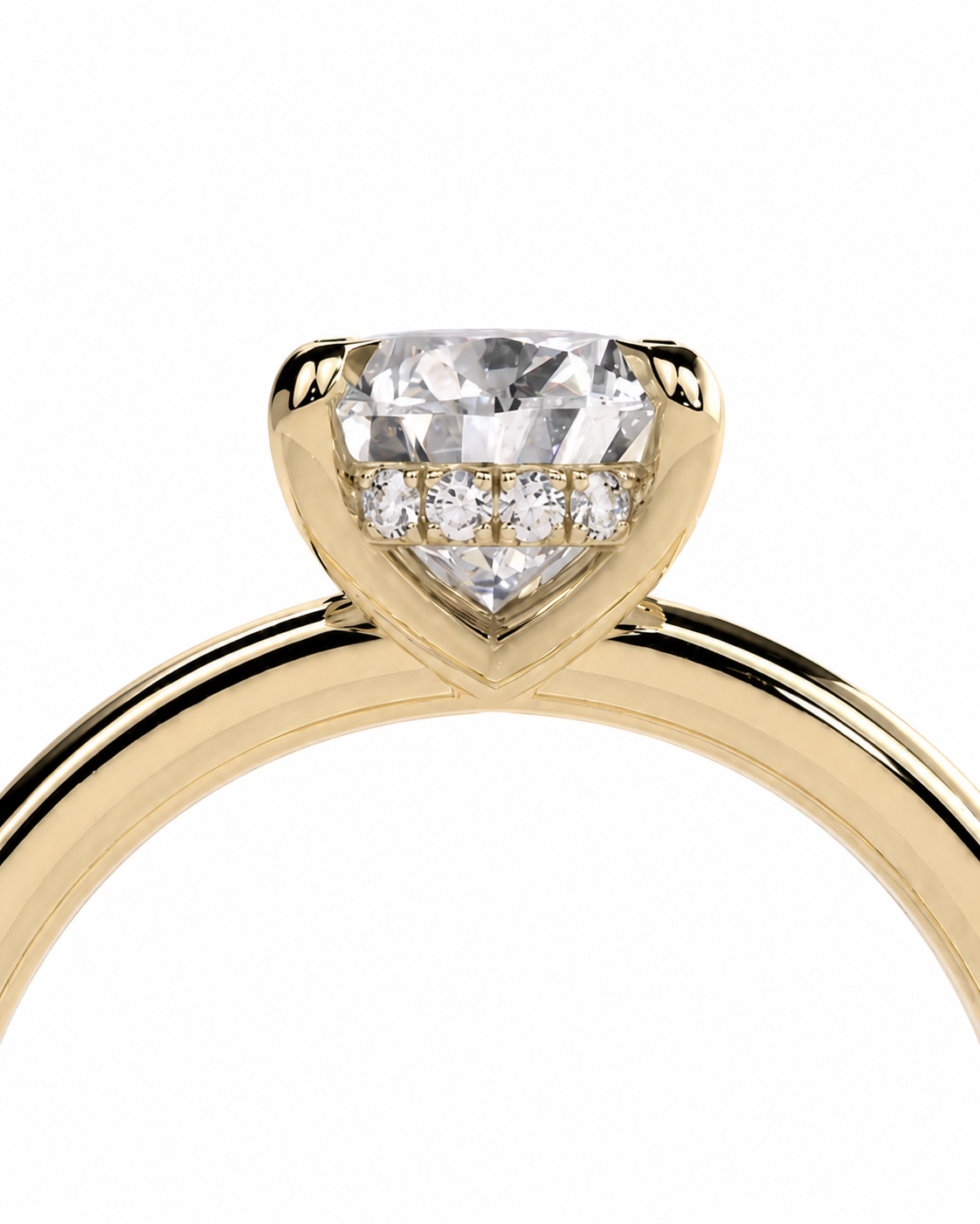 color_10K_YG, color_14K_YG &&	
A close-up of a yellow gold ring featuring a heart-shaped clear gemstone in a prong setting, with three smaller round diamonds lined up on the band above the center stone, set against a plain white background.