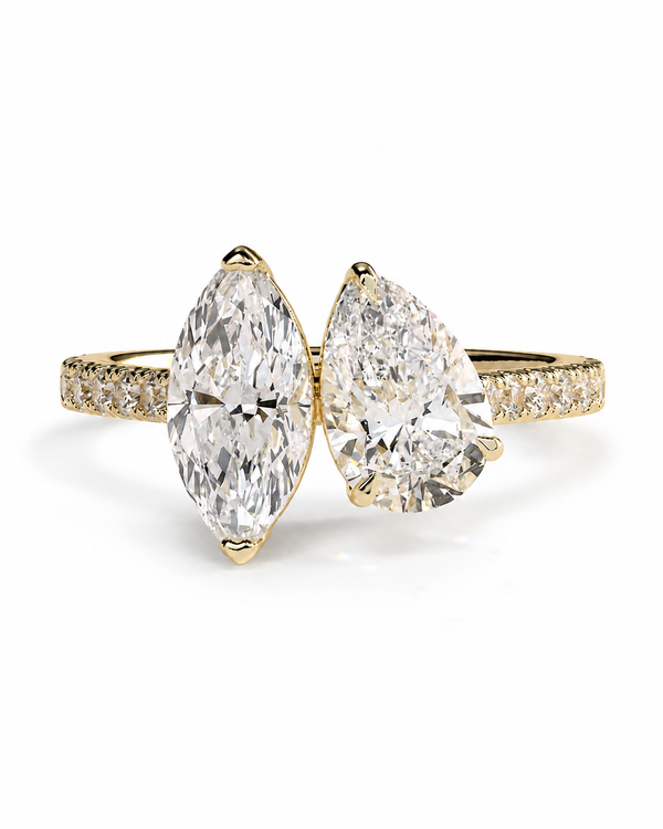 color_10K_YG, color_14K_YG &&	
A yellow gold double-ring engagement ring featuring two large pear-cut diamonds on the front and a row of small round diamonds along the shoulders, set against a clean white background.