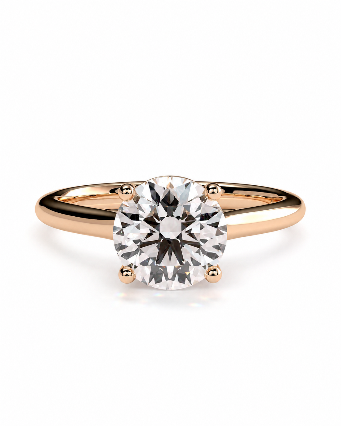 color_10K_RG, color_14K_RG &&	A classic solitaire engagement ring featuring a round brilliant-cut diamond set in a rose gold four-prong band, shown on a clean white background.