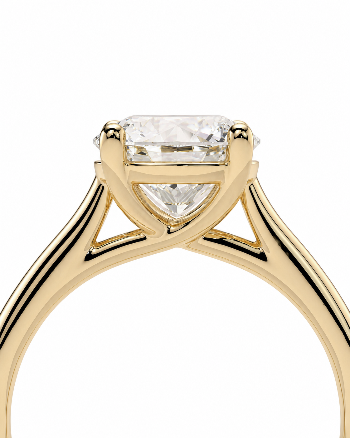 color_10K_YG, color_14K_YG &&	
A close-up of a yellow gold solitaire engagement ring featuring a rectangular clear gemstone in a four-prong setting, shown against a solid white background.