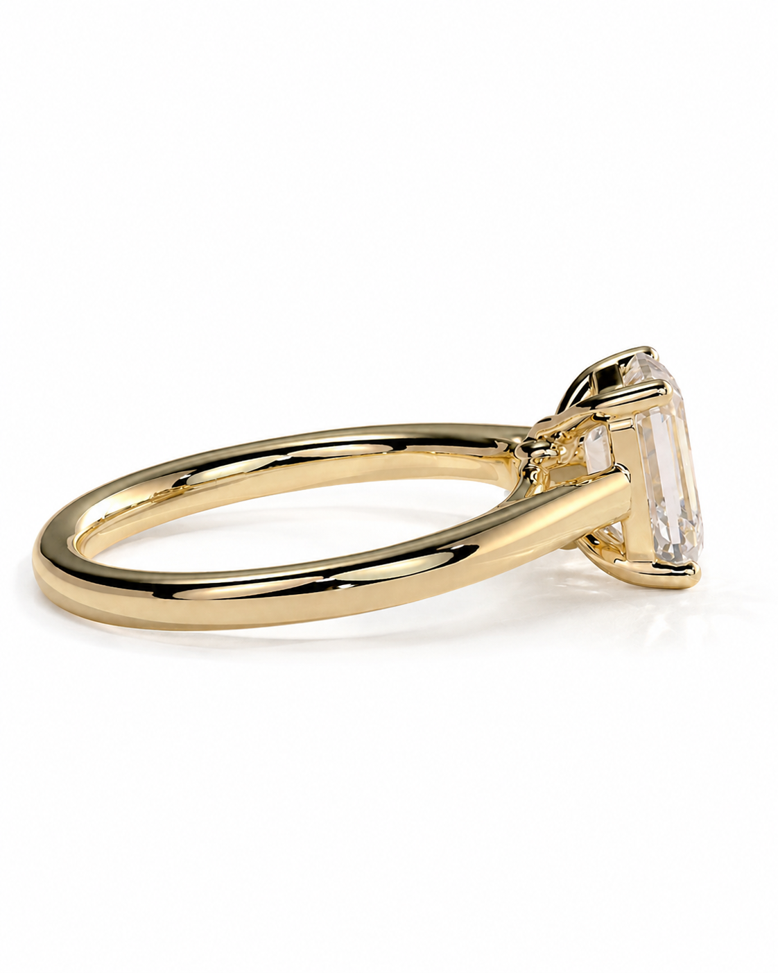color_10K_YG, color_14K_YG &&	
A gold ring with a large clear rectangular gemstone, shown in a side profile view on a white background.
