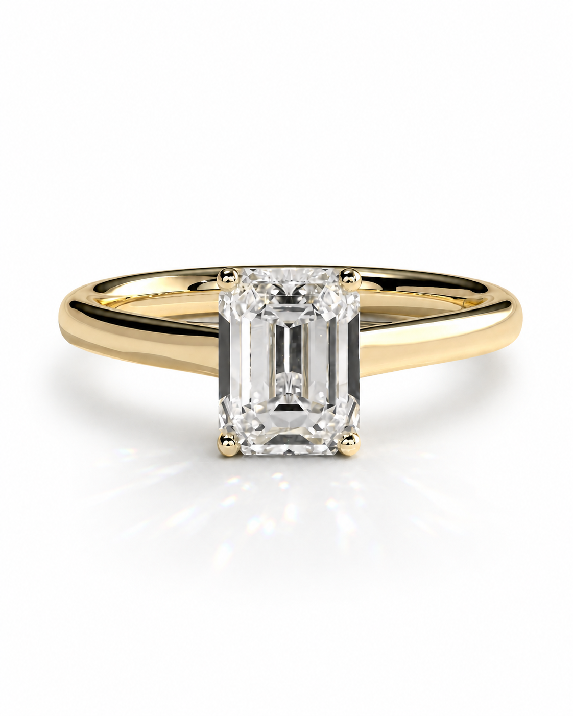 color_10K_YG, color_14K_YG &&	
An emerald-cut diamond engagement ring with a yellow gold band, shown on a clean white background with a soft reflection.