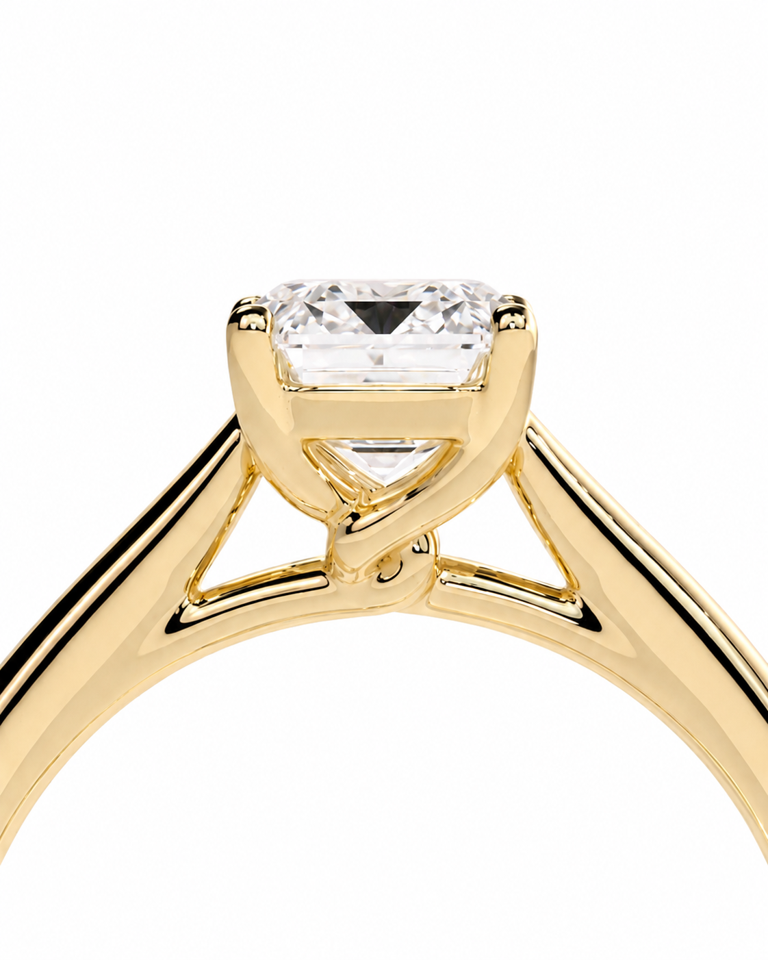 color_10K_YG, color_14K_YG &&	
A close-up of a yellow gold solitaire engagement ring featuring a rectangular princess-cut clear gemstone in a four-prong setting, shown against a solid white background.
